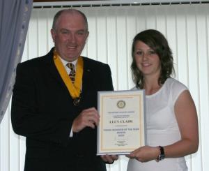 Lucy Clark being presented with her certificate by Vice President David Strachan.